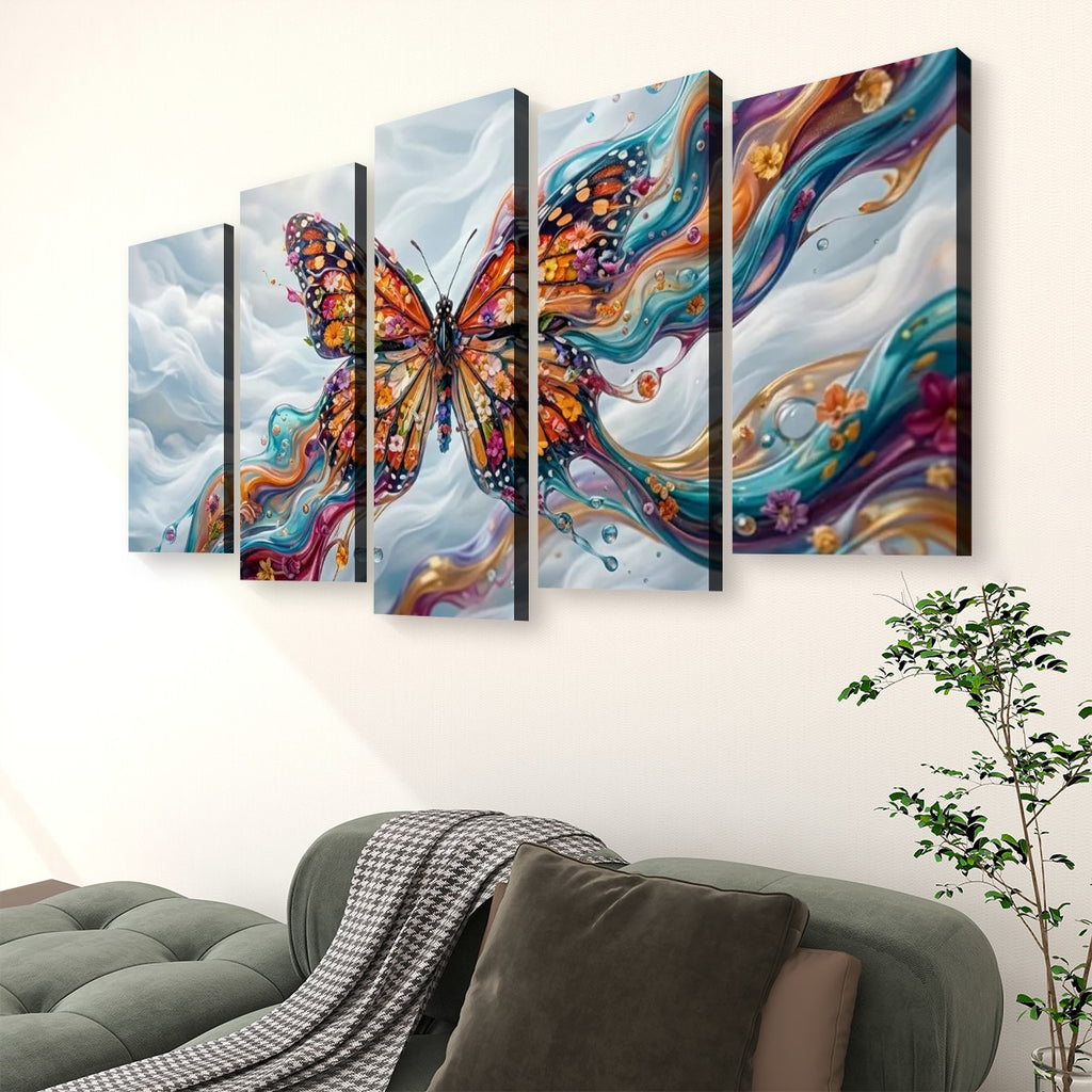 A five-panel canvas wall art set depicting a colorful Monarch butterfly over abstract swirling clouds, displayed above a green sofa in a living room setting.