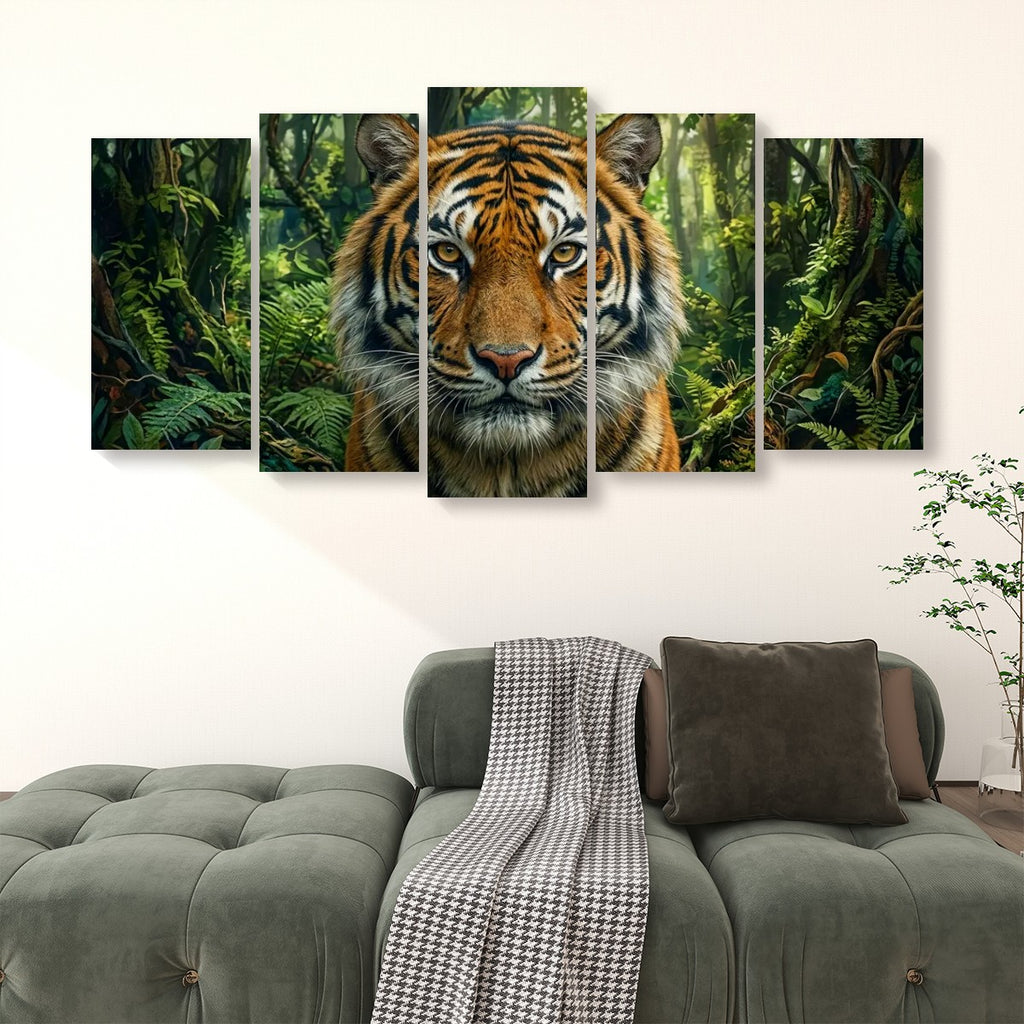 A five-panel canvas wall art set depicting a close-up tiger face in a lush green jungle, displayed above a modern gray sofa in a living room setting.