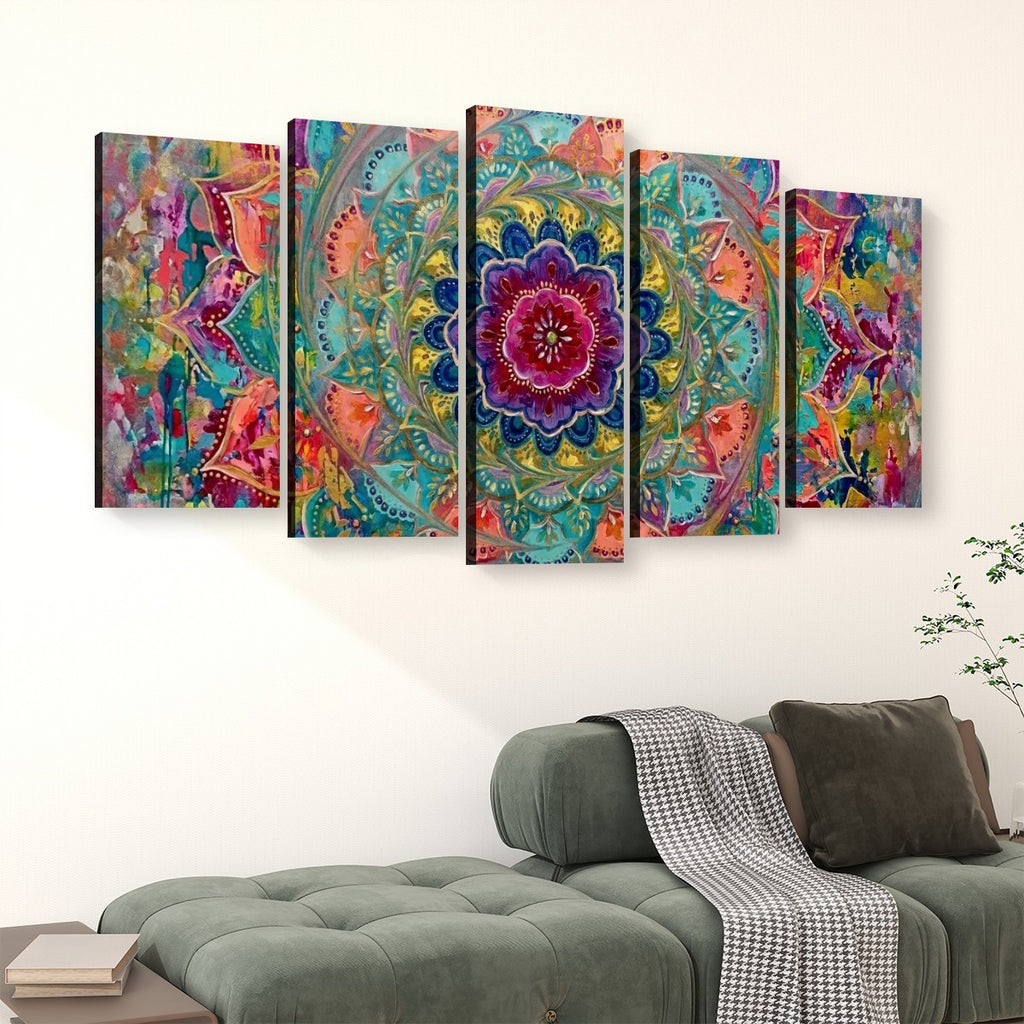 A 5-panel canvas wall art set featuring a vibrant, colorful bohemian mandala design, displayed on a white wall above a green sofa in a living room setting.