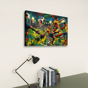 A colorful canvas wall art print depicting a dynamic soccer scene, displayed on a light beige wall above a dark gray desk with a black desk lamp and books.