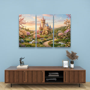 A three-panel canvas wall art set depicting a whimsical fairytale castle in a lush, colorful garden, displayed on a light blue wall above a wooden console table.