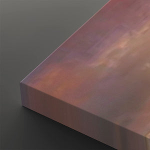 A close-up of a rectangular canvas or panel with a soft iridescent finish shifting between pink, purple, and peach tones, shown against a dark gray background.