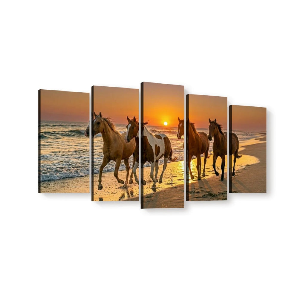 Five-panel canvas wall art showing four horses walking on a beach at sunset, displayed against a plain white background.