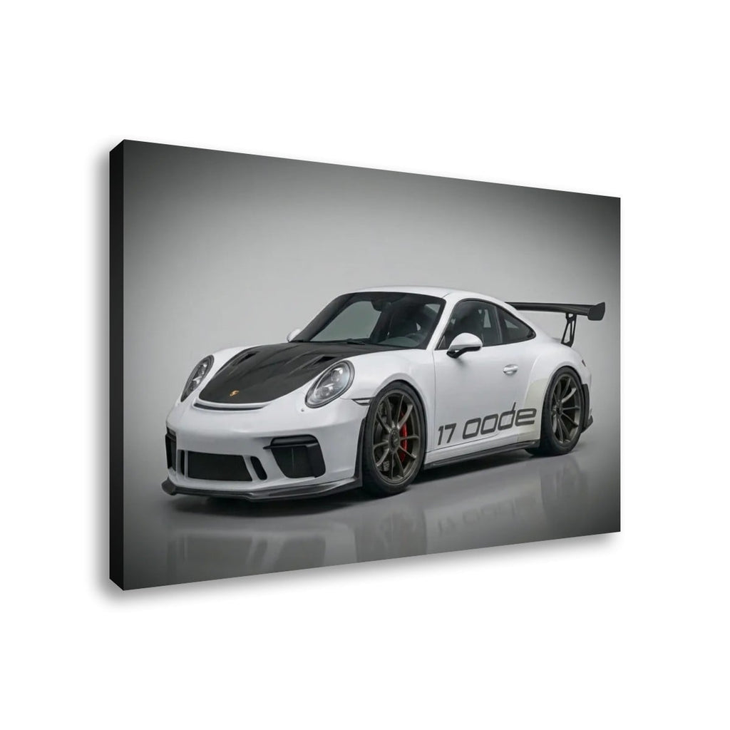 A rectangular wall art print or canvas showing a white Porsche 911 GT3 with a black carbon-fiber hood and rear wing, photographed at an angle against a light gray studio background.