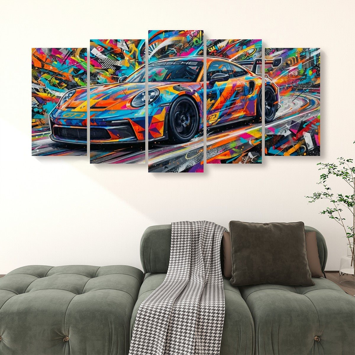 A multi-panel canvas wall art set depicting a colorful, abstract sports car, displayed above a green sofa in a modern living room setting.