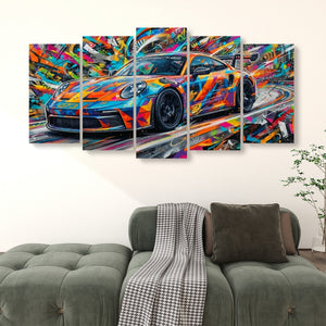 A multi-panel canvas wall art set depicting a colorful, abstract sports car, displayed above a green sofa in a modern living room setting.