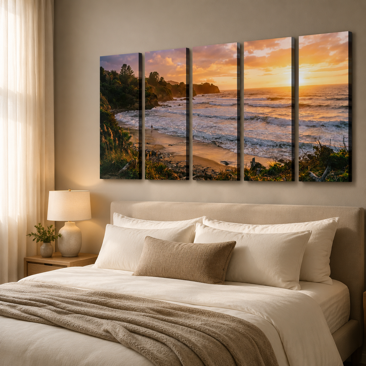 A five-panel canvas wall art set depicting a coastal beach sunset, displayed above a neatly made bed in a modern bedroom setting.