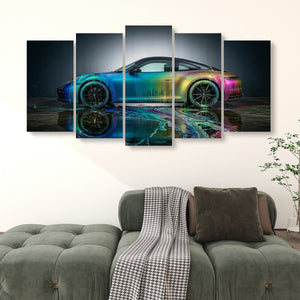 A 4-panel canvas wall art set depicting a sports car with a vibrant iridescent rainbow reflection, displayed on a wall above a green sofa in a living room setting.