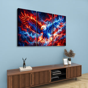 A three-panel canvas wall art set depicting a dramatic fiery eagle with red, orange, and blue flames, displayed on a light blue wall above a wooden console table.