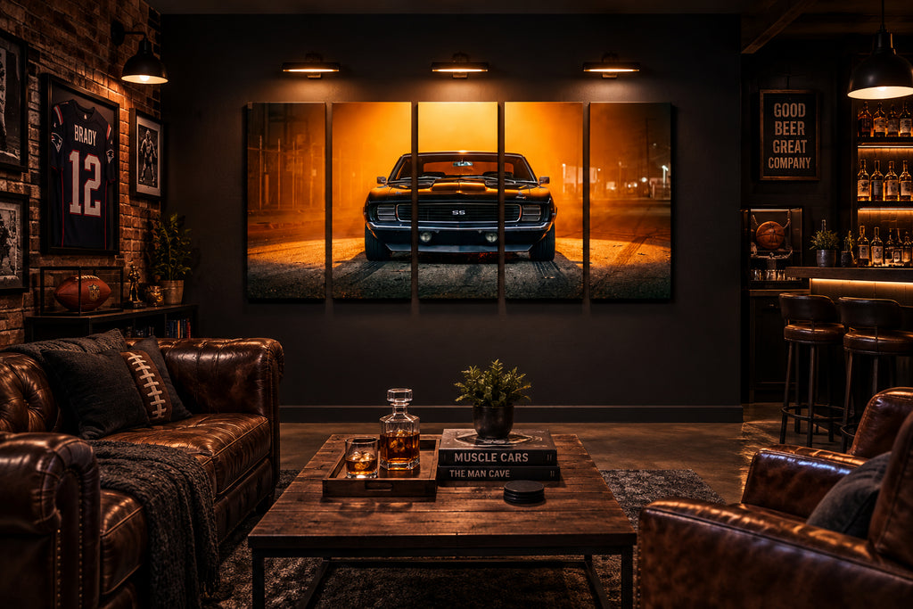 A four-panel canvas wall art print depicting a black 1969 RS/SS Chevy Camaro muscle car in a foggy, golden-orange street scene, displayed in a mancave