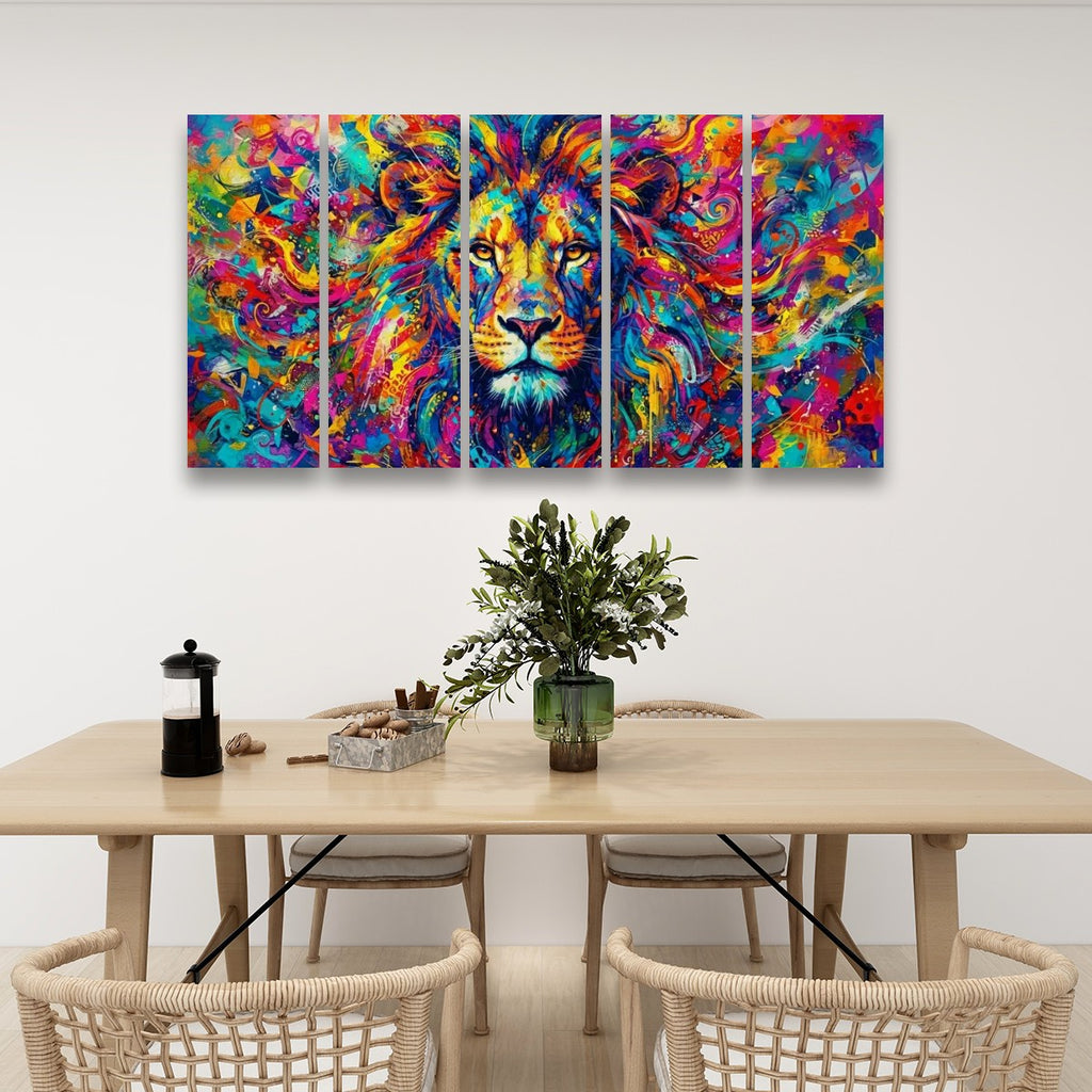 A five-panel canvas wall art set depicting a colorful, vibrant painted lion head, displayed on a white wall above a wooden dining table with chairs and a vase.