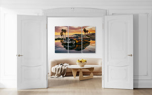 Modern living room with a large wall art piece depicting a sunset over water and palm trees.