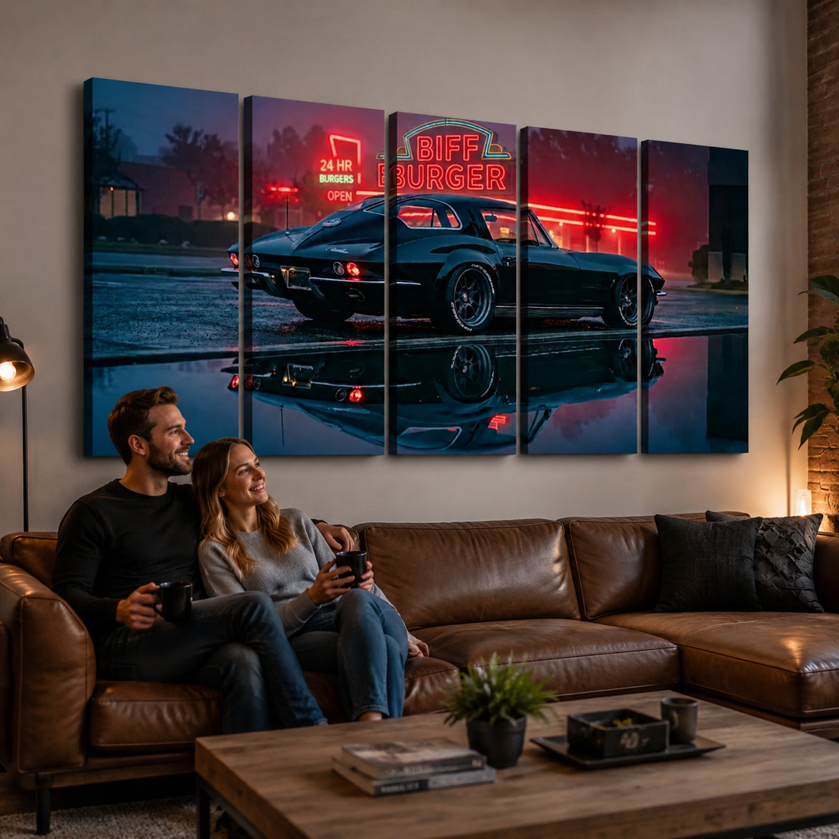 A 5-panel canvas wall art set depicting a classic black1963 Split Window Chevy Corvette  at night with red neon signs and a reflection in water, displayed above a brown leather sofa where a couple is sitting and looking at the screen.