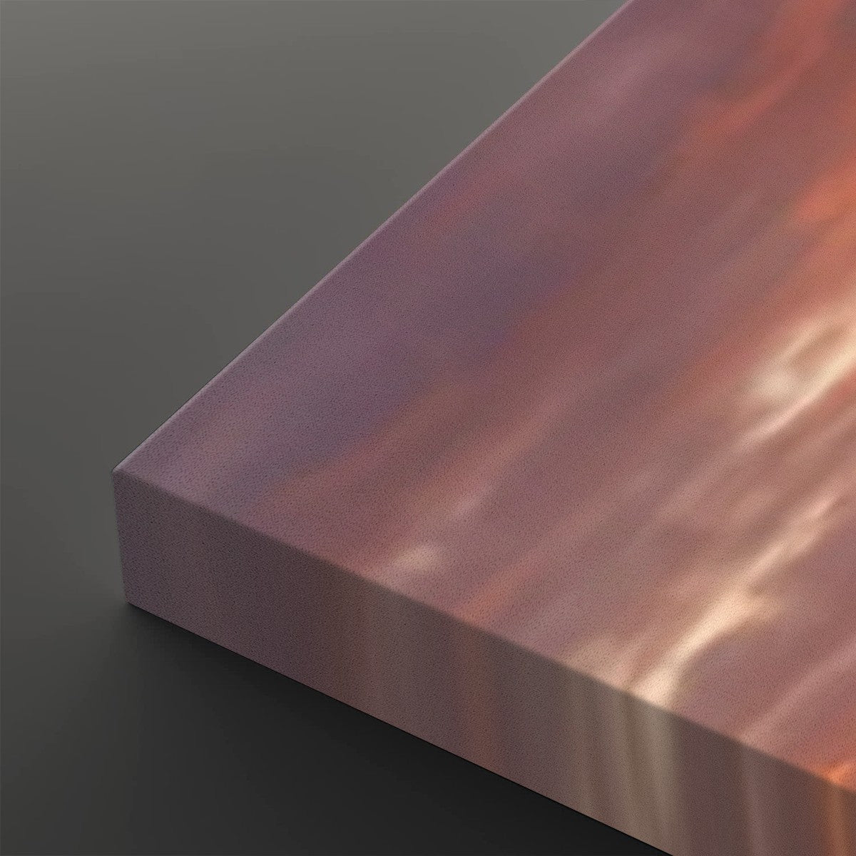 A close-up of a rectangular panel with a metallic, iridescent finish shifting between pink, purple, and copper tones, set against a dark gray background.
