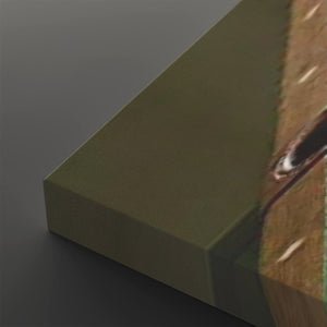 A close-up of a rectangular olive green textured panel or block, shown at an angle against a dark gray background, with part of a brown patterned surface visible along the right edge.