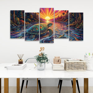 A 5-panel canvas wall art set depicting a colorful, vibrant sea turtle swimming in a sunset over water, displayed on a white wall above a styled dining table with chairs, books, and a vase.