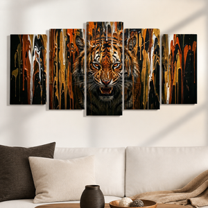 A 5-panel canvas wall art set depicting a roaring tiger with dramatic gold, orange, black, and brown paint drips, displayed on a white wall above a modern white sofa with decorative pillows.