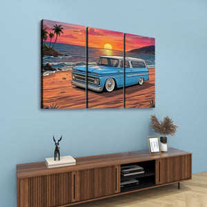 A three-panel canvas wall art print depicting a classic light blue 1966 Chevy Suburban station wagon parked on a beach at sunset, displayed on a light blue wall above a wooden console table.