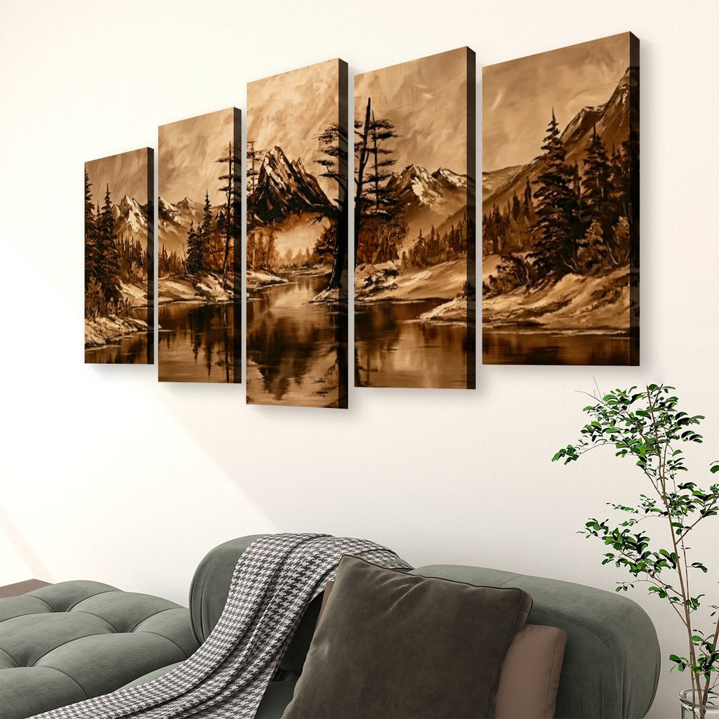 A five-panel canvas wall art set depicting a sepia-toned mountain lake landscape with pine trees, displayed above a green sofa in a living room setting.