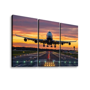 Three-panel canvas wall art showing a commercial airplane taking off from a runway at sunset, displayed against a plain white background.