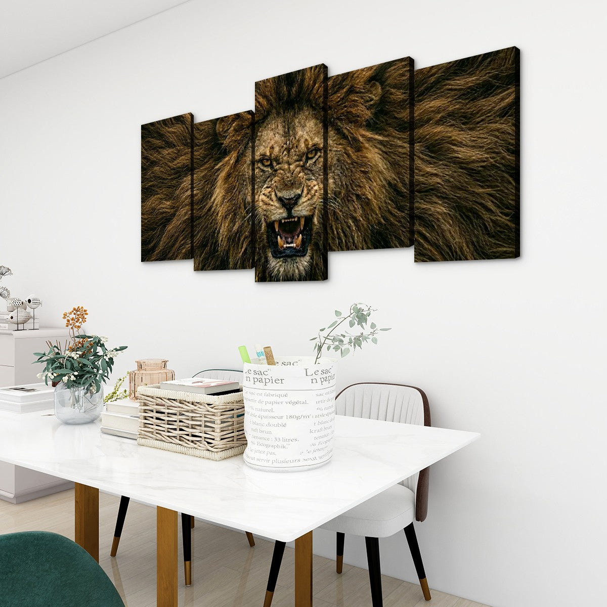 A 5-panel canvas wall art set depicting a roaring lion with an open mouth, displayed on a white wall above a dining table in a modern room setting.