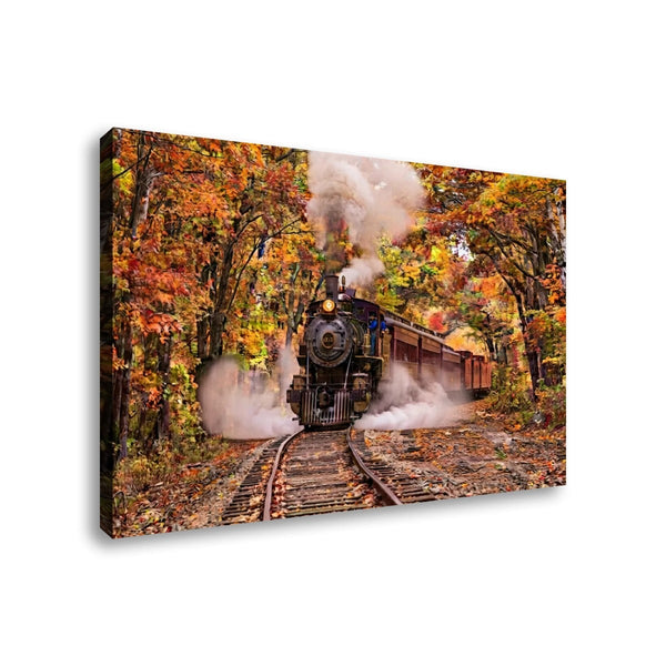 A rectangular canvas wall art print showing a black steam locomotive traveling on tracks through an autumn forest with orange and yellow foliage, photographed against a plain white background.