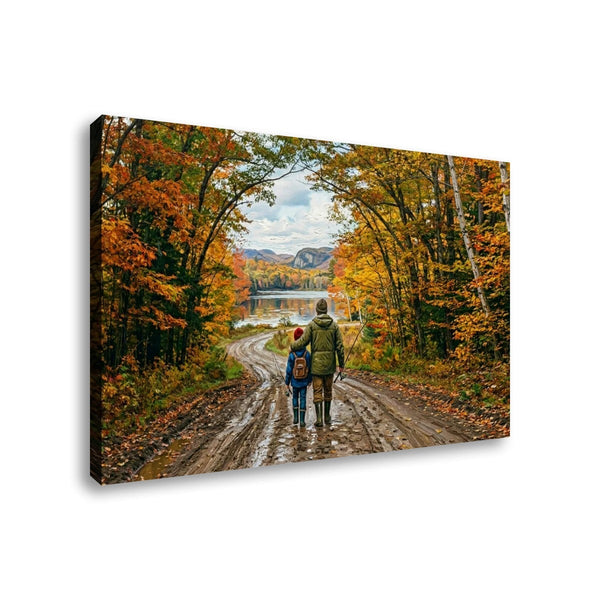 A rectangular wall art canvas showing a family hiking along a muddy road surrounded by colorful autumn trees, with a lake and mountains in the distance. The canvas is photographed at a slight angle against a plain white background.