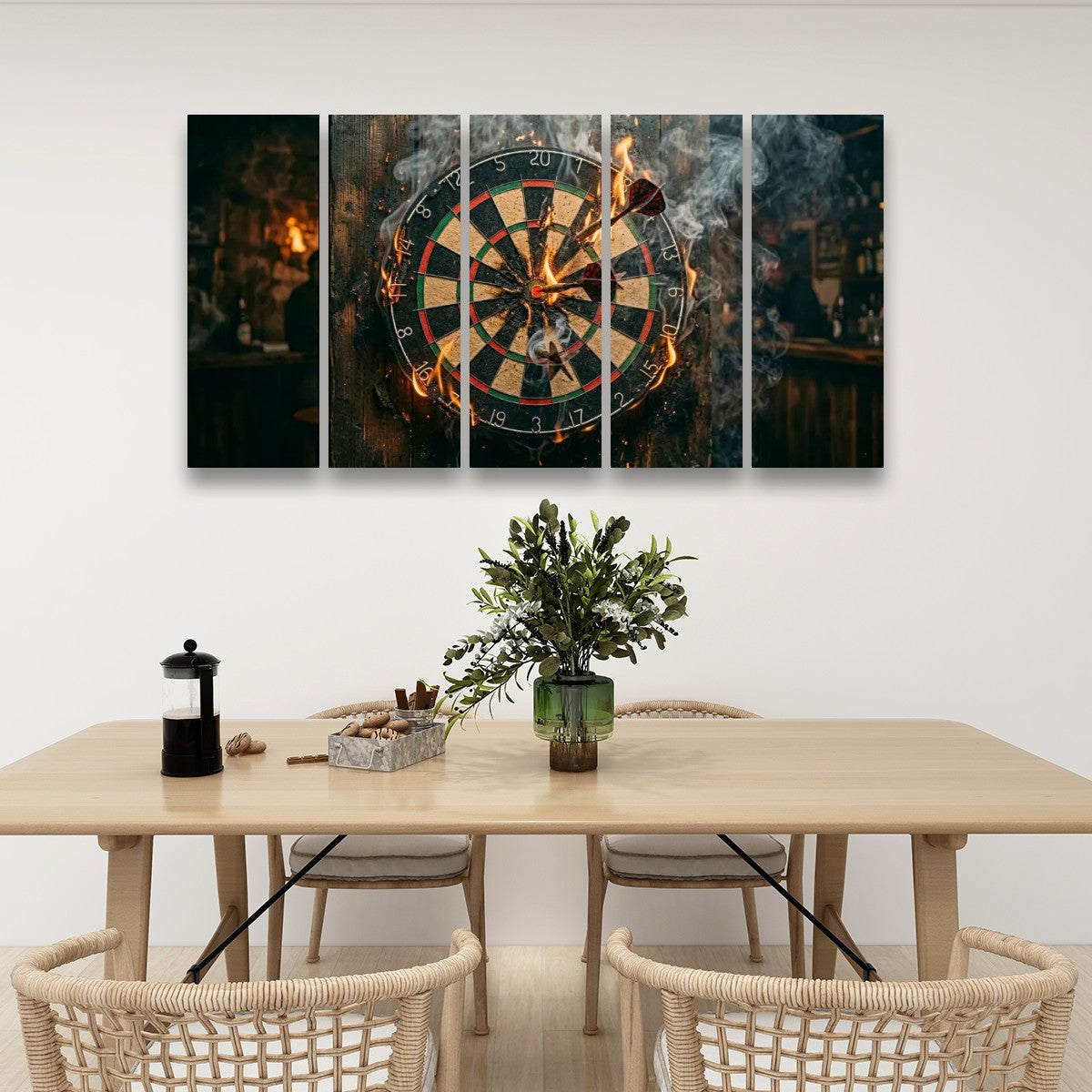 A five-panel canvas wall art set depicting a burning dartboard in a dimly lit bar, displayed on a white wall above a wooden dining table with chairs.