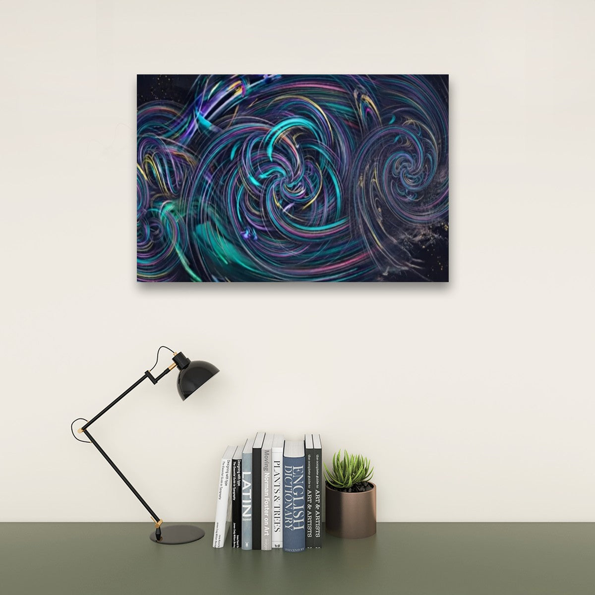 Abstract wall art featuring swirling cosmic patterns in deep blue, teal, purple, and pink, displayed on a light beige wall above a dark green table with a black desk lamp, books, and a small succulent.