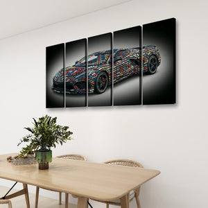 A four-panel canvas wall art set depicting a sports car made of colorful geometric shapes, displayed on a white wall above a wooden dining table with chairs and a plant.