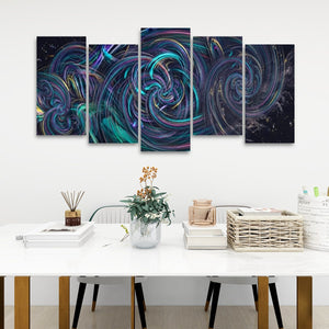 A five-panel canvas wall art set featuring an abstract swirling cosmic design in vibrant teal, purple, and black, displayed on a white wall above a styled white table with books, a vase, and a basket.