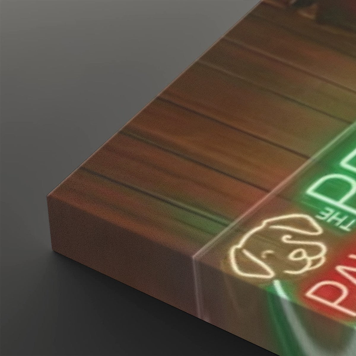 A close-up of a rectangular acrylic wall sign showing a warm brown wood-grain background with glowing neon-style text and a dog outline in green, red, and yellow.