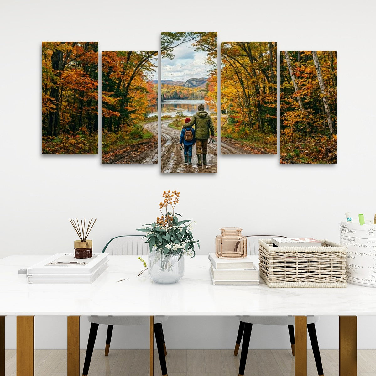 A five-panel canvas wall art set depicting a couple walking along a dirt road through an autumn forest with colorful fall foliage, displayed on a white wall above a styled dining table.