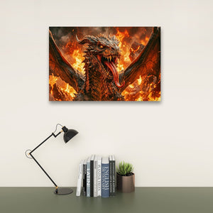 A rectangular wall art print showing a fiery dragon head and wings, displayed above a desk with a black lamp, books, and a small succulent against a light gray wall.