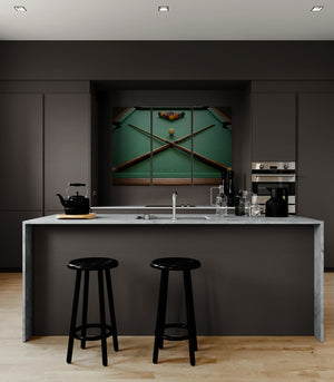 Modern kitchen with dark cabinets, a green backsplash, and black bar stools.