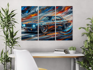 Triptych painting of a 1969 Chevy Camaro on a wall above a desk with plants.