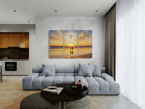 Modern living room with a large sectional sofa, coffee table, and wall art of a beach scene.