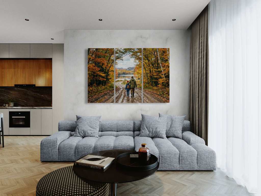 Modern living room with a large sectional sofa, coffee table, and wall art depicting a scenic landscape.