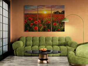 Green sofa in a living room with a large wall art of a sunset over a field of red poppie flowers.