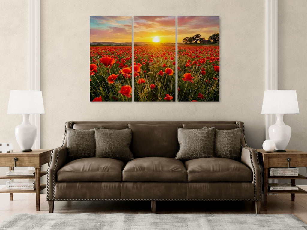 Brown sofa in a living room with a large wall art of a sunset over a field of red poppie flowers.
