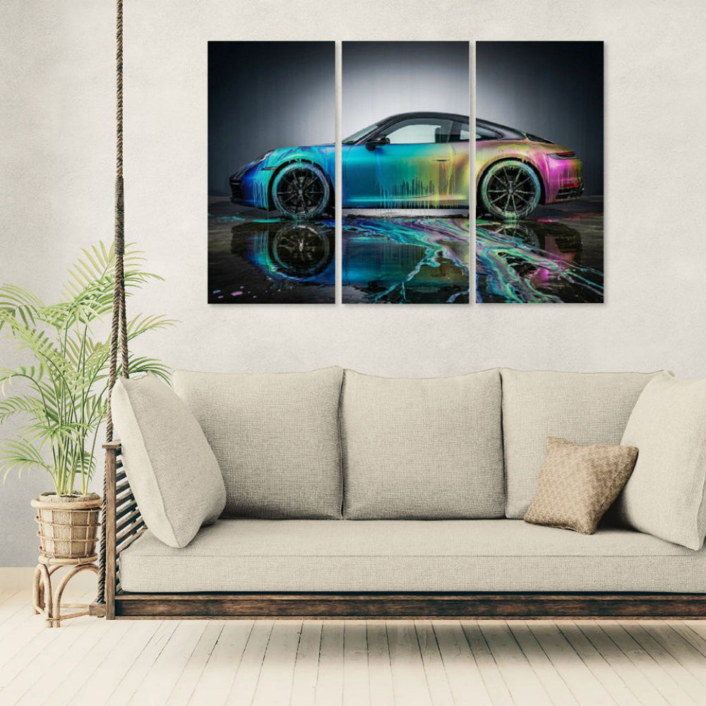 Triptych wall art of a colorful Porsche 911 Sportscar on a light gray wall above a beige sofa.