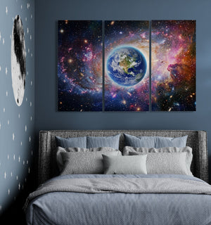 Bedroom with space-themed wall art above a bed