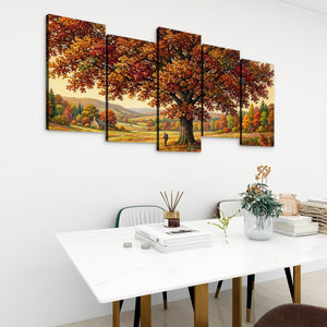 A 4-panel canvas wall art set depicting a large autumn tree with orange and yellow foliage over a scenic landscape, displayed on a white wall above a modern white dining table.