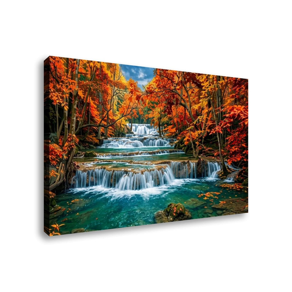 A rectangular canvas wall art print showing a colorful autumn forest with Huay Mae Khamin Falls flowing into a turquoise stream, photographed against a plain white background.