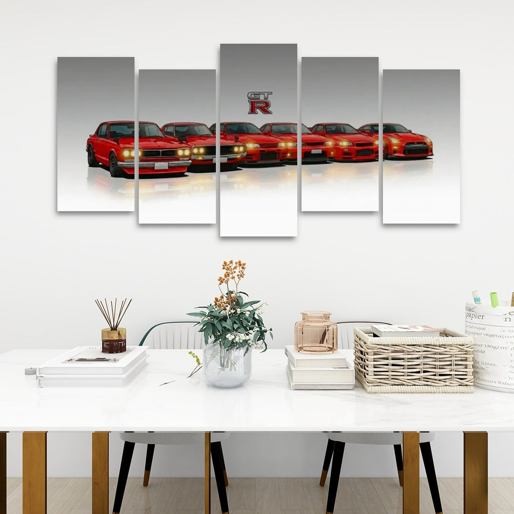 A five-panel canvas wall art set depicting a lineup of red sports cars with a large 'GTR R' logo above them, displayed on a white wall above a styled dining table.