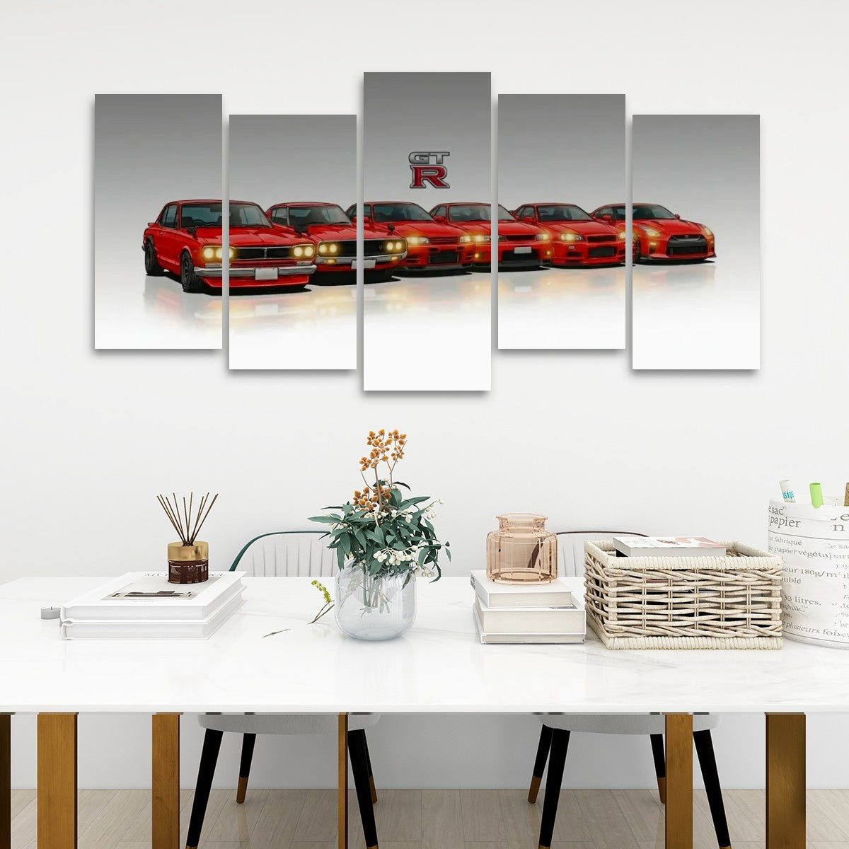A five-panel canvas wall art set depicting a lineup of red sports cars with a large 'GTR R' logo above them, displayed on a white wall above a styled dining table.