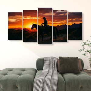 A five-panel canvas wall art set depicting a cowboy riding a horse at sunset, displayed on a white wall above a green tufted sofa in a living room setting.
