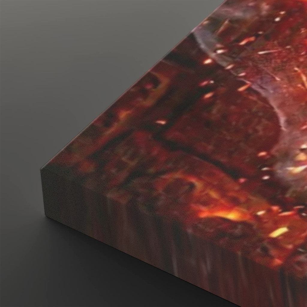 A close-up of a rectangular canvas or print showing a fiery abstract scene in deep red, orange, and brown tones, photographed on a dark gray background.