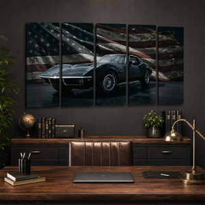 A 5-panel canvas wall art set depicting a black classic 1972 Corvette sports car against a waving American flag, displayed in a modern office setting above a wooden desk.