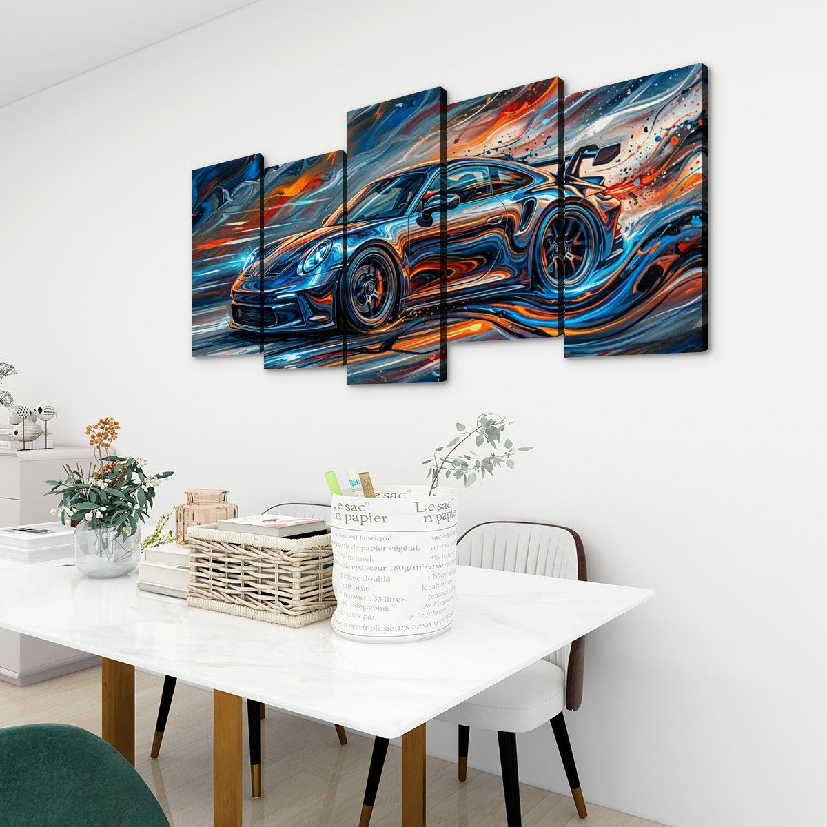 A 5-panel canvas wall art set depicting a blue sports car with vibrant orange, red, and white abstract brushstrokes, displayed on a white wall above a dining table in a modern room setting.
